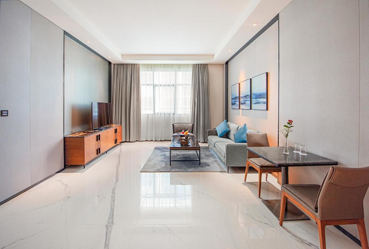 Asiana Grand Hotel Dubaj Kültér fotó A living room in a serviced apartment in Beijing, China