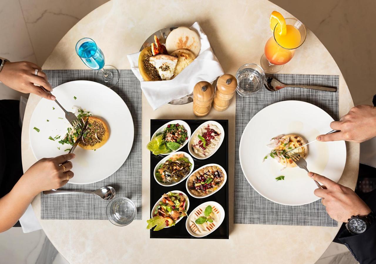 Asiana Grand Hotel Dubaj Kültér fotó A selection of meze